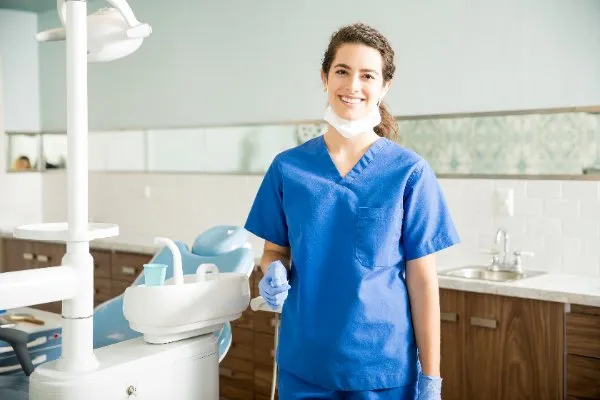 portrait-of-smiling-dentist-in-scrubs-at-clinic-2025-02-18-16-44-06-utc1-68230ec13f49b